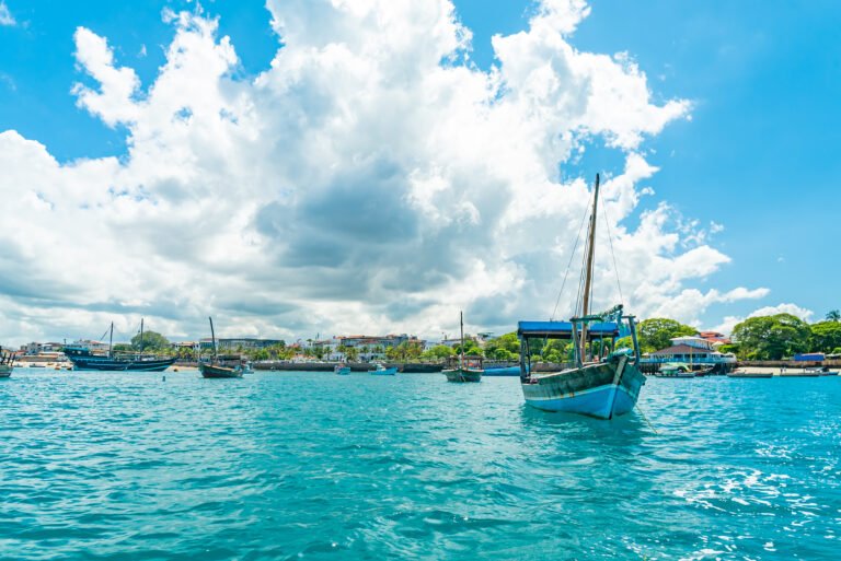 STONE TOWN, ZANZIBAR - DECEMBER 22, 2021: Boats in a port of Stone Town, Zanzibar, Tanzania.